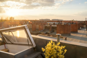 Berlin, attic, terrace, roof landscape with chimneys, open roof hatch, back light Berlin, attic, terrace, roof landscape with chimneys, open roof hatch, back light